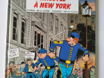 LES TUNIQUES BLEUES n°45 Emeutes à New-York eo 2002 ( tampon presse vu sur photo ) TTBE+++++SUP